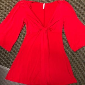 Red tunic with low neckline
